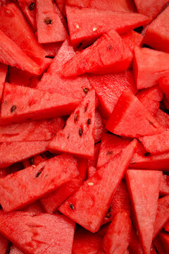Juicy slices of ripe watermelon. Close-up, vertical photo. Top view.
