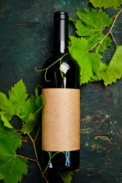 Red wine in a bottle on the table, free space for text. Aged wine in bottles. Top view.