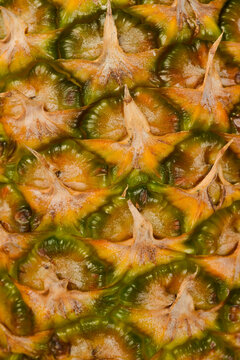 Pineapple peel texture. Ripe tropical pineapple. Abstract pineapple peel background. Macro photo.