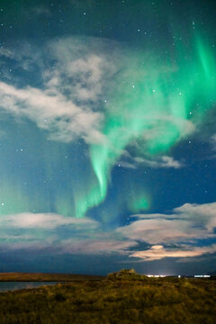 Aurora borealis lights up the night sky over Iceland landscape