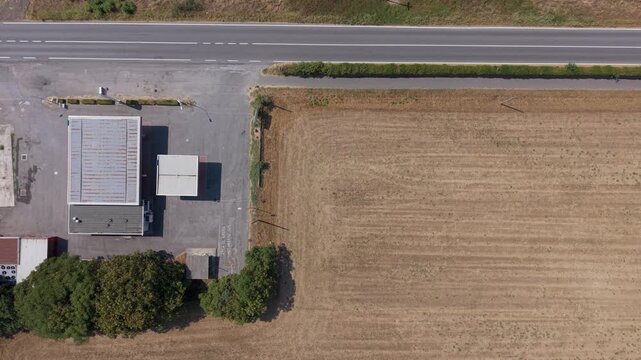 Empty Gas Station Beside Agricultural Fields With Copy Space