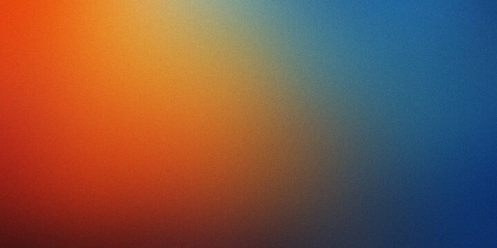 Abstract gradient of warm orange transitioning to cool blue suggesting autumn fall colors with subtle texture