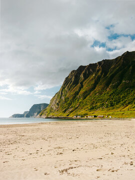 Hoddevik sandy beach in Norway landscape coastal rocks and calm sea summer season, explore scenic nature in Vestland travel offbeat Scandinavian destinations