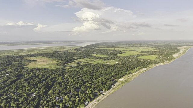 Aerial drone footage showing the Gorai and Padma rivers around Kushtia, Bangladesh, with expansive green fields, vegetation, rural settlements, and natural river landscapes.