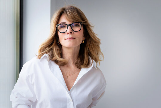 Portrait of a confident businesswoman over white background
