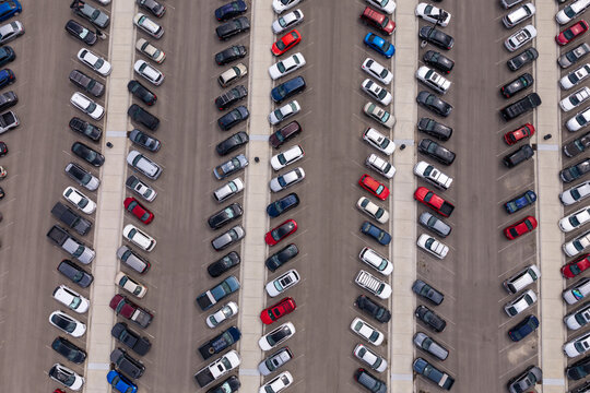 Aerial view of cars parked in rows in an outdoor parking lot in Eagle Mountain, Utah, United States.