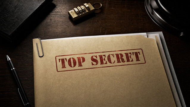 Top secret folder stamped in red text on dark wooden desk with combination lock and pen