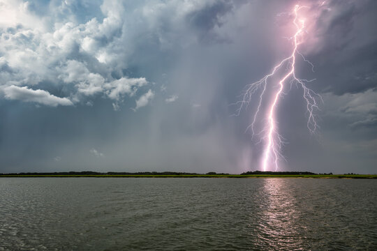 Lightning strikes over the water in Beaufort SC during a storm