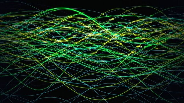 Vibrant light trails flow in a seamless loop of undulating waves