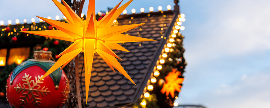 Beautiful traditional German Christmas Market square in city center many carousel Christmas tree light and decoration. Christmas and new year celebration season. Advent festive New year fair