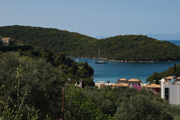 Naklejka premium beautiful Sivota bay landscape in Greece, scenic Ionian sea coast with turquoise water and green island, summer vacation, luxary yachting and Mediterranean travel concept, picturesque Sivota coastline