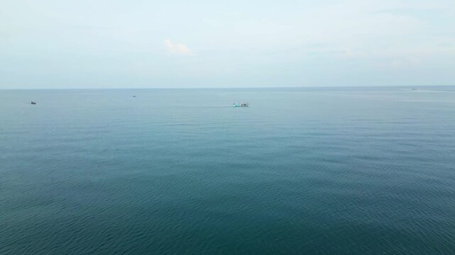 Fishing Boat Crosses Calm Water North Java Coast Indonesia Drone Track In 4K 60FPS