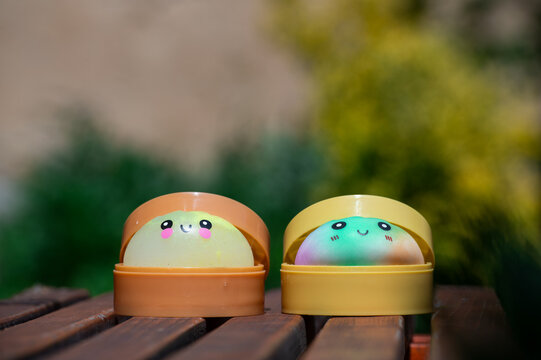 Adorable dumpling squishy toys against a natural background.