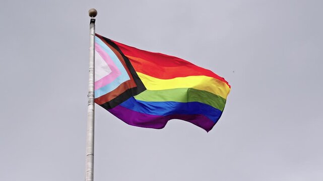 LGBT community. Tolerance and equality. World gay pride. Rainbow gay flag. Pride month. LGBTQ rainbow flag. LGBT rainbow flag waving against sky. Symbol of pride and LGBTQ. Colorful pride flag