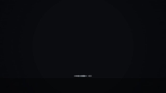 Airplane seat belt icon glowing dimly in the dark, indicating safety and fastening procedure