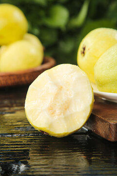 Fresh Guava Fruit with Creamy White Flesh on Wooden Board - Tropical Healthy Food