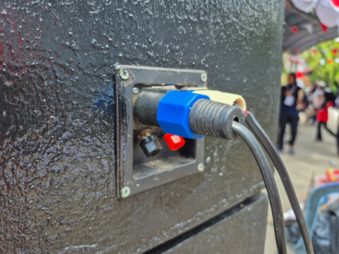 Speakon Cable Connector Plugged into Speaker Cabinet Audio System Terminal Panel Close Up