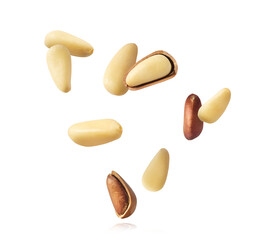 Obraz premium Fresh raw pine nuts flying in the air isolated. Food levitation concept.