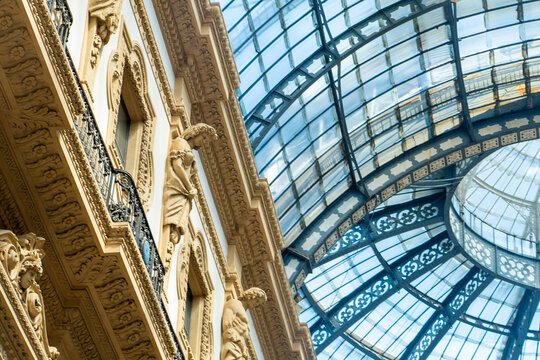 Milan Italy Architectural Detail with Glass Roof and Sculptures inside Galleria Vittorio Emanuele. Italian architecture