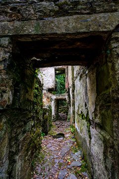 Stone doorway framing ruined interior of derelict quarry building at Dorothea Quarry, North Wales