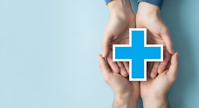 Medical cross icon held in cupped hands, healthcare insurance concept, blue medical symbol for first aid and hospital services