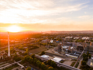 Fototapeta premium Sunset view over industrial area with skyline and sky in the background