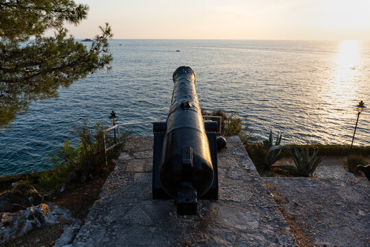 An ancient artillery cannon, once used for coastal defense, now a decorative relic on seaside promenades. Rovinj, Croatia.