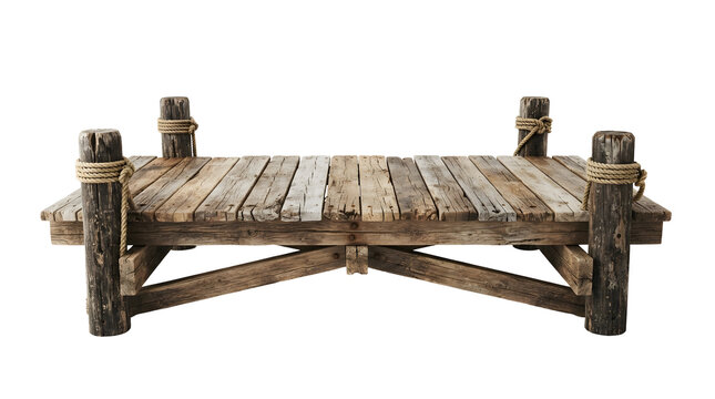 Isolated old wooden pier or small dock on posts wrapped with rope for boats and fishing