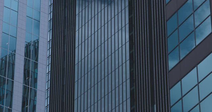 A cityscape of cloud reflecting the building at the business town telephoto shot
