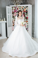Fototapeta premium Young Bride Posing in Elegant White Wedding Dress – Bridal Portrait, Romantic Wedding Photoshoot and Bridal Fashion