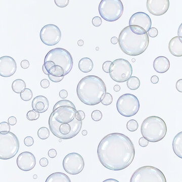 Transparent soap bubbles floating against a white background