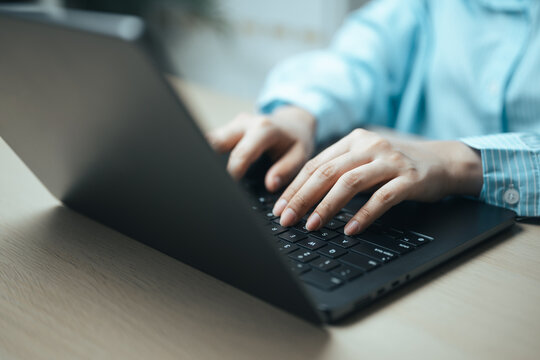 using freelance laptop with typing businessperson; a freelance laptop work scene. using guides buyer choices, freelance frames the scene, and laptop adds useful meaning. In a clear visual scene.