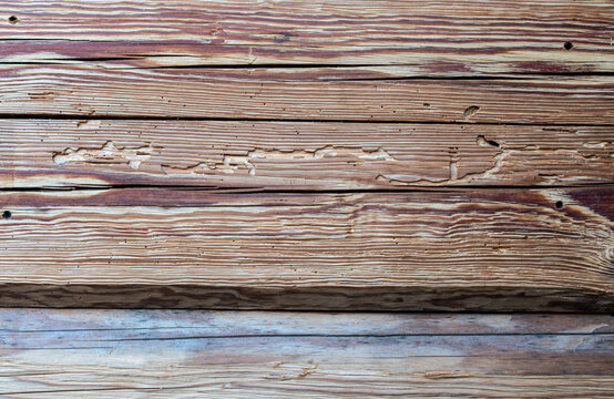 weathered wooden plank texture with natural grain, cracks and rustic aged surface