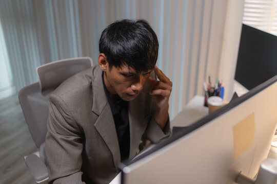 Professional financial analyst reviewing stock market charts across multiple screens using a tablet, laptop and calculator to evaluate price movements, technical indicators, and investment strategies.