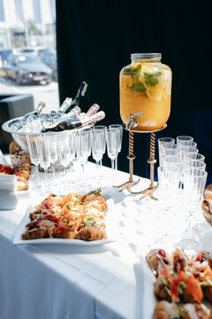 Food and drinks on corporate party table.