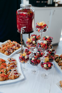 Food and drinks on corporate party table.