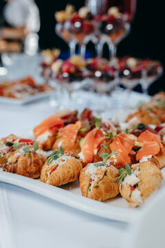 Food and drinks on corporate party table.
