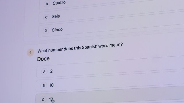 Student using AI chatbot on computer to solve math problems and study English and Spanish online. Modern education with AI assistant, chatbot, AI agent, e-learning and homework.