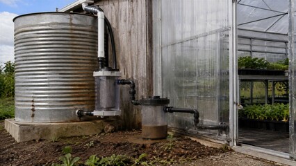 Obraz premium Rainwater Collection And Filtration System Attached To A Rustic Greenhouse