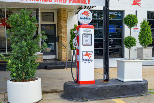 Metairie, LA, USA - August 8, 2026: Retro Gasoline Pump at the Front of Mobil Gas Station on Live Oak Street in Suburban New Orleans