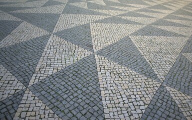 Obraz premium old stone pavement in lisbon