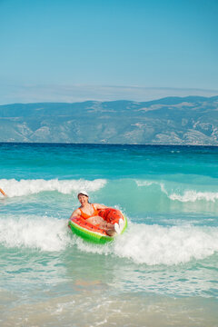 People floating on ring in Adriatic sea