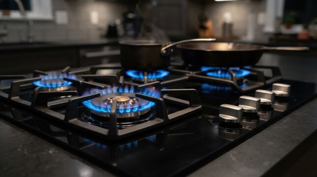 Modern gas stove with blue flames cooking food in pots and pans