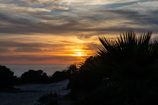 sunset on La Barrosa beach in Sancti Petri, Cadiz, Spain