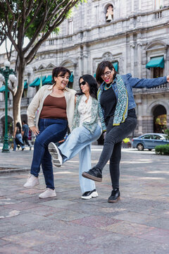 group of latin senior women friends having fun in street outdoor in Mexico Latin America, mexican middle age females 