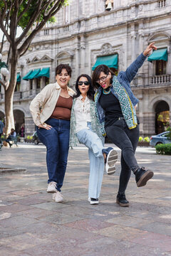 group of latin senior women friends having fun in street outdoor in Mexico Latin America, mexican middle age females 