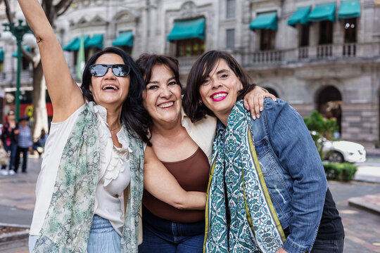 group of latin senior women friends having fun in street outdoor in Mexico Latin America, mexican middle age females 