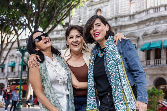 group of latin senior women friends having fun in street outdoor in Mexico Latin America, mexican middle age females 