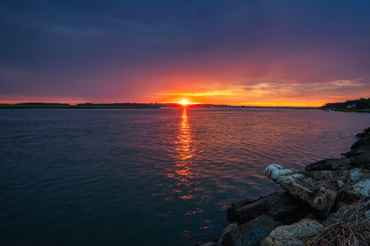 Sunset over the waterfront in Beaufort SC creating bright colors in the sky
