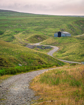 Portrait of Frazer Hush mine track near Rookhope, in the North Pennines a National Landscape of sweeping  moorlands, renowned for vast open skies, winding rivers and historic stone buildings